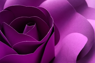 Photo of Beautiful purple flower made of paper as background, closeup