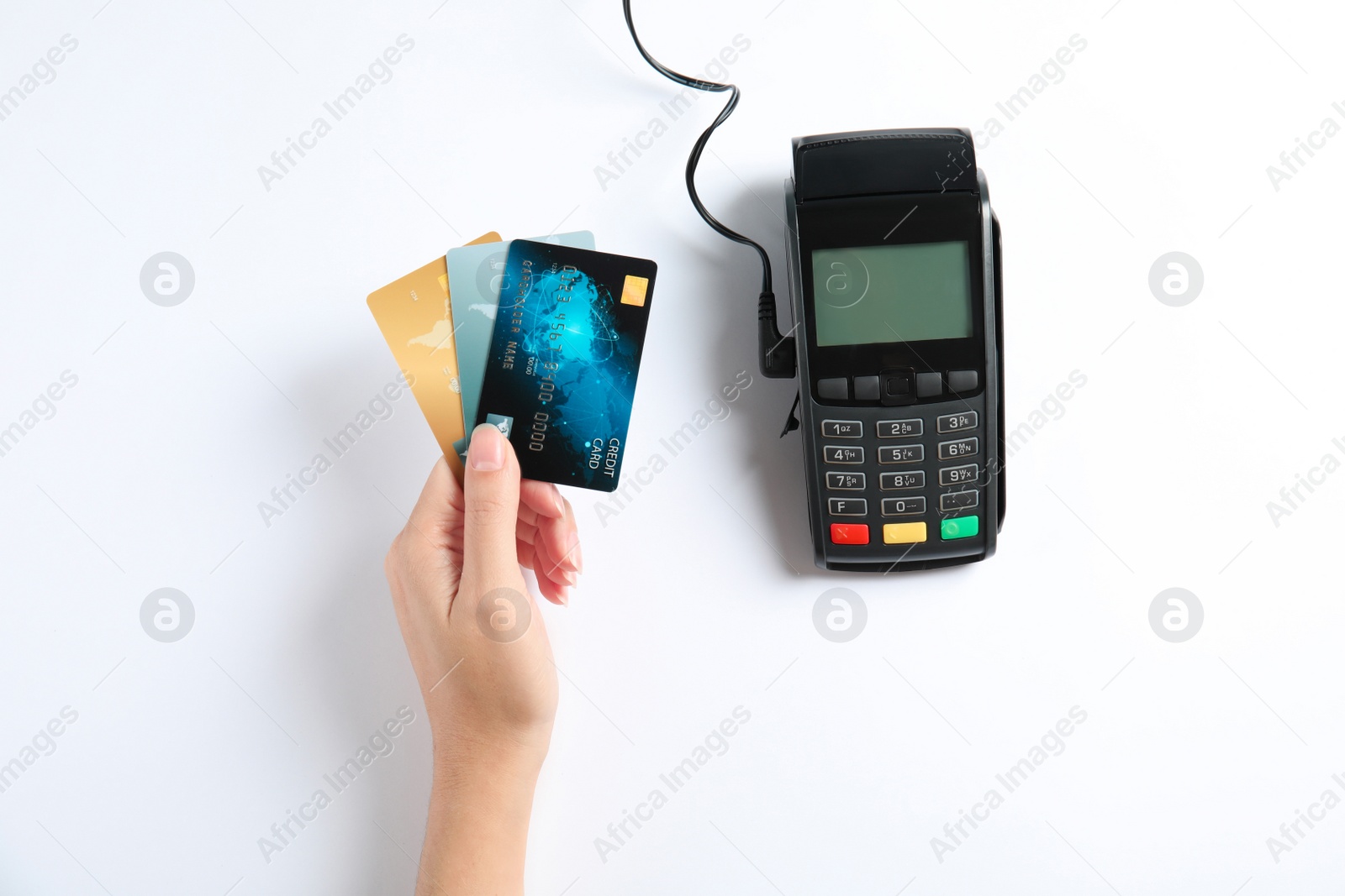 Photo of Woman with credit cards and modern payment terminal on white background, top view
