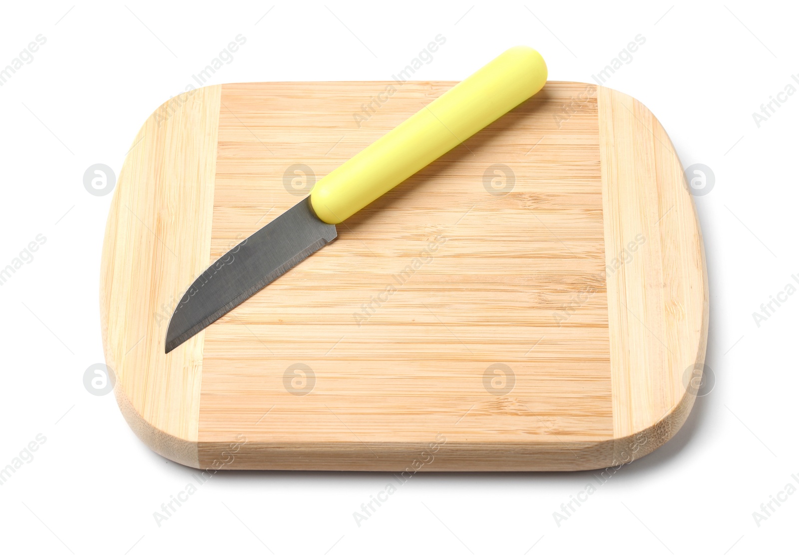 Photo of Paring knife and wooden board isolated on white