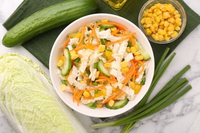 Tasty salad with Chinese cabbage served on white marble table, top view