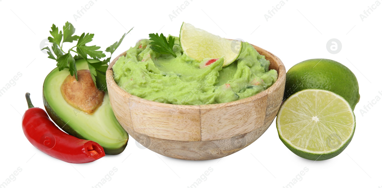 Photo of Bowl of delicious guacamole and ingredients isolated on white