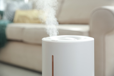 Photo of Modern air humidifier at home, closeup view