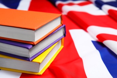 Learning foreign language. Different books on flag of United Kingdom, space for text