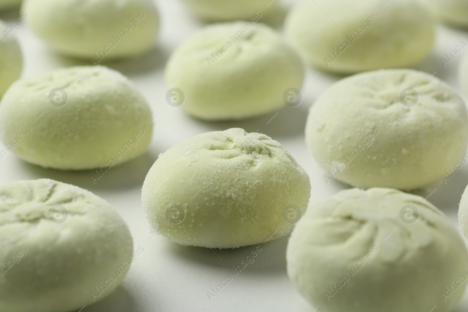 Photo of Raw dumplings on white background, closeup. Traditional dish