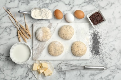 Photo of Flat lay composition with wheat dough and ingredients on marble background