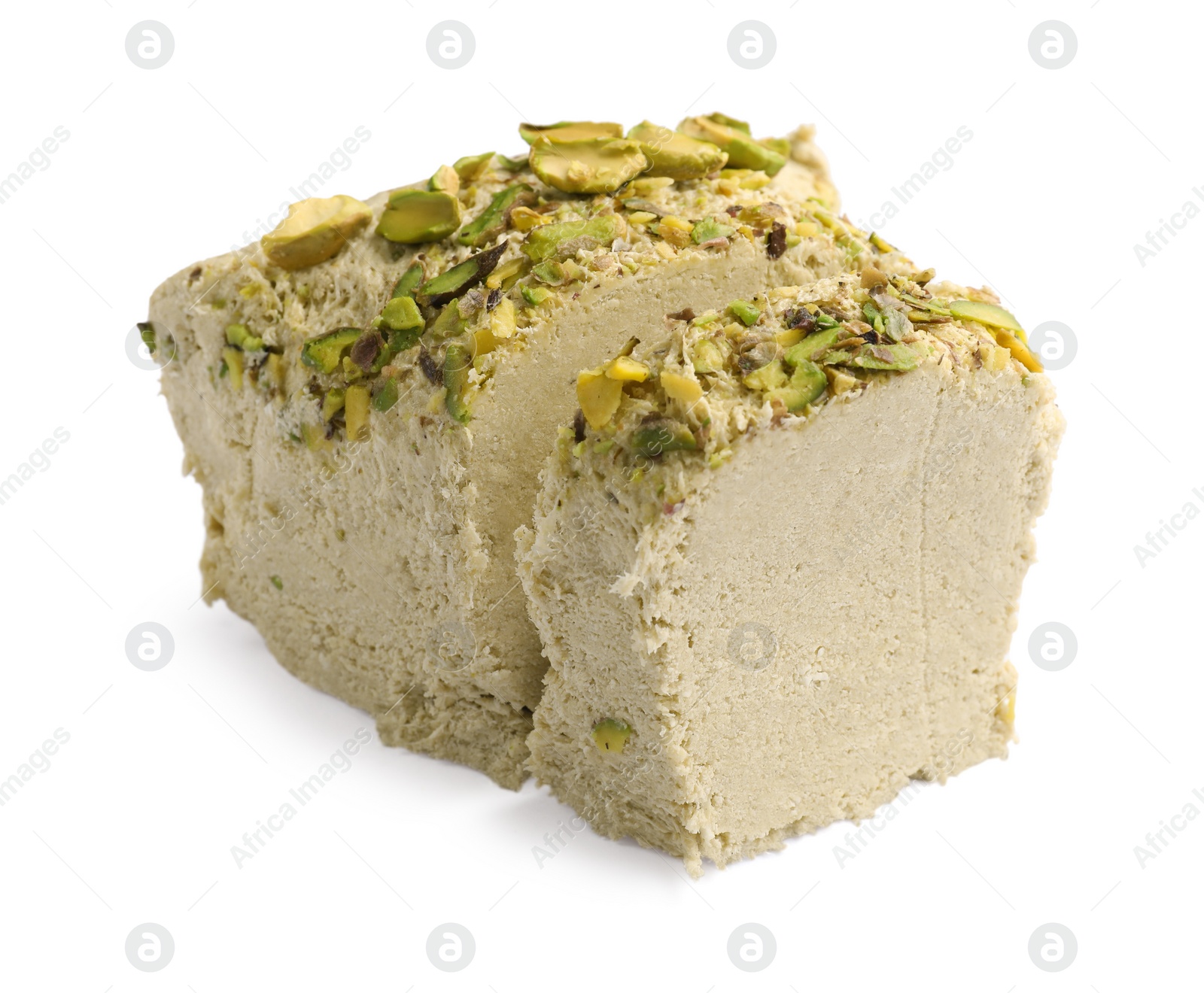 Photo of Tasty halva with pistachios isolated on white