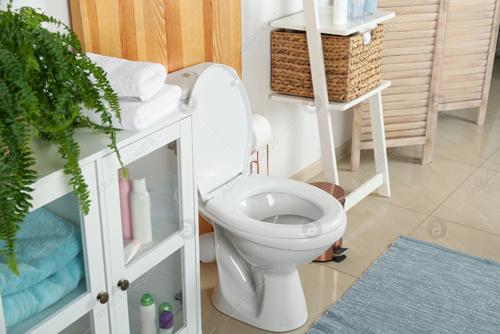 Photo of Stylish toilet bowl in modern bathroom interior