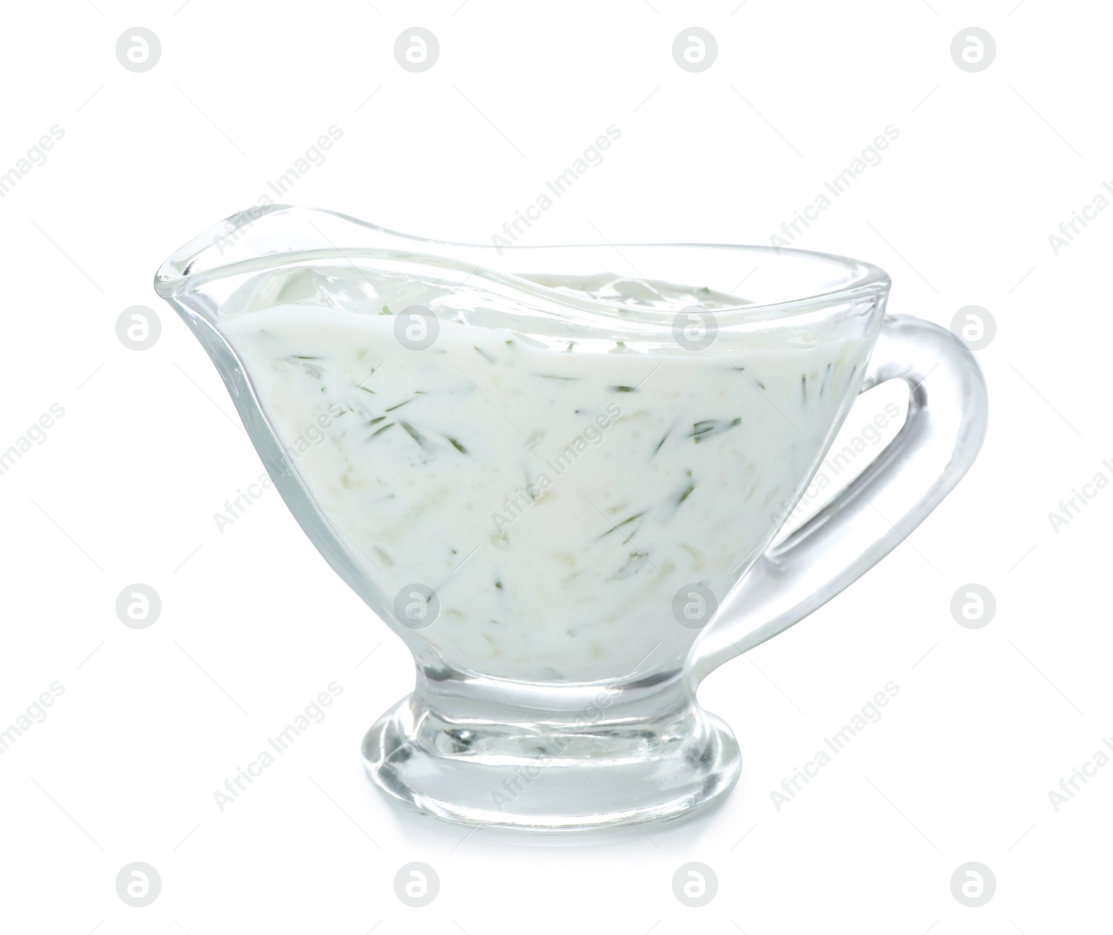 Photo of Glass gravy boat with cucumber sauce on white background