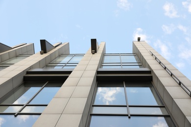 Modern office building with tinted windows on sunny day