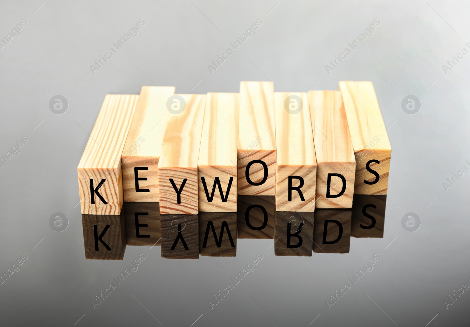 Photo of Blocks with word KEYWORDS on grey background