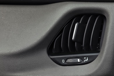 Photo of Air conditioner system in modern car, closeup