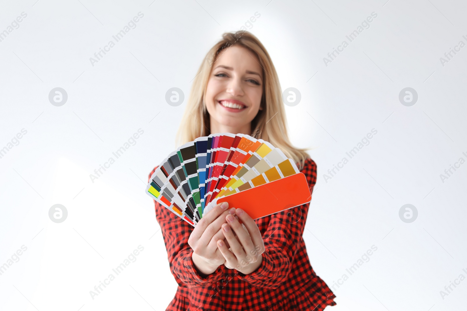 Photo of Young woman with color palette on white background