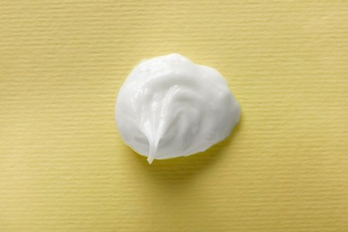 Sample of ointment on beige background, top view