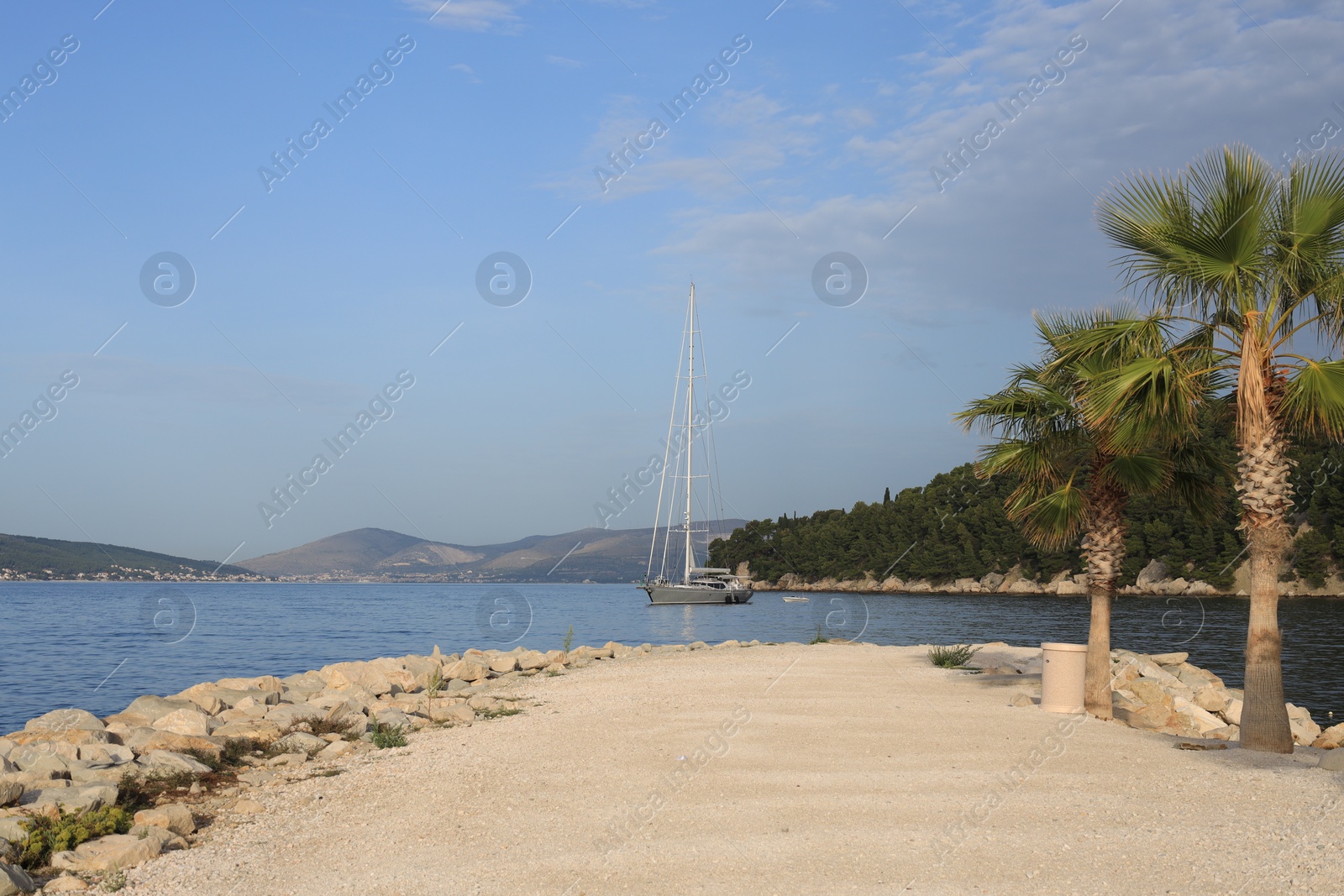 Photo of Beautiful view of tranquil sea and yacht on summer day