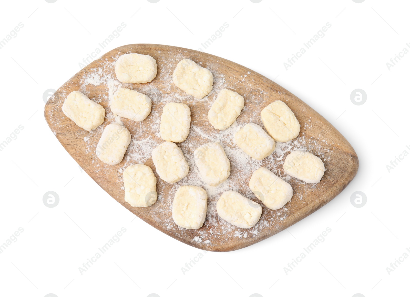 Photo of Making lazy dumplings. Wooden board with cut dough and flour isolated on white, top view