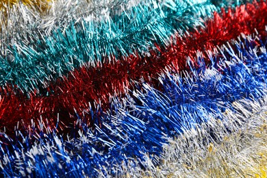 Many colorful tinsels as background, closeup view