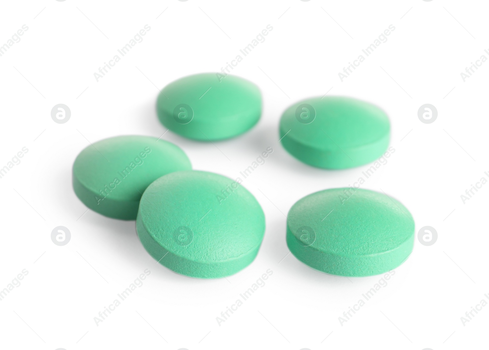 Photo of Many light green pills isolated on white