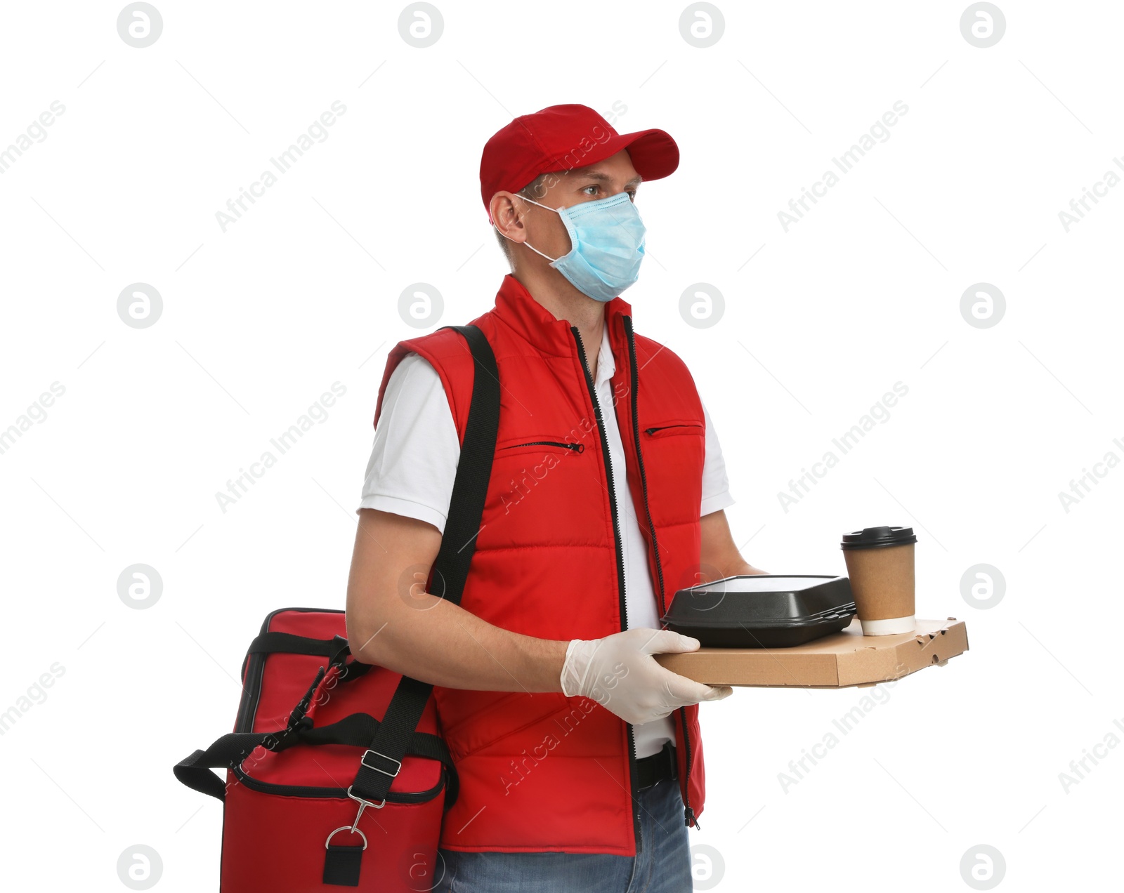 Photo of Courier in protective gloves and mask holding order on white background. Food delivery service during coronavirus quarantine