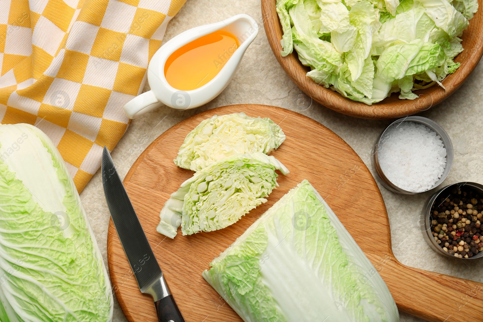 Photo of Fresh Chinese cabbages, oil and spices on light table, flat lay