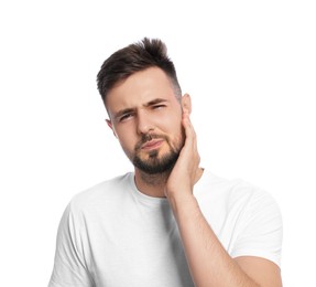 Photo of Young man suffering from ear pain on white background
