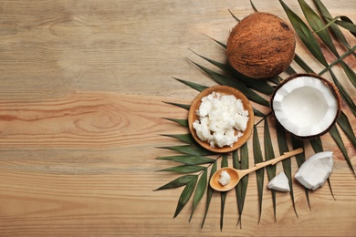 Flat lay composition with coconut oil on wooden background. Healthy cooking