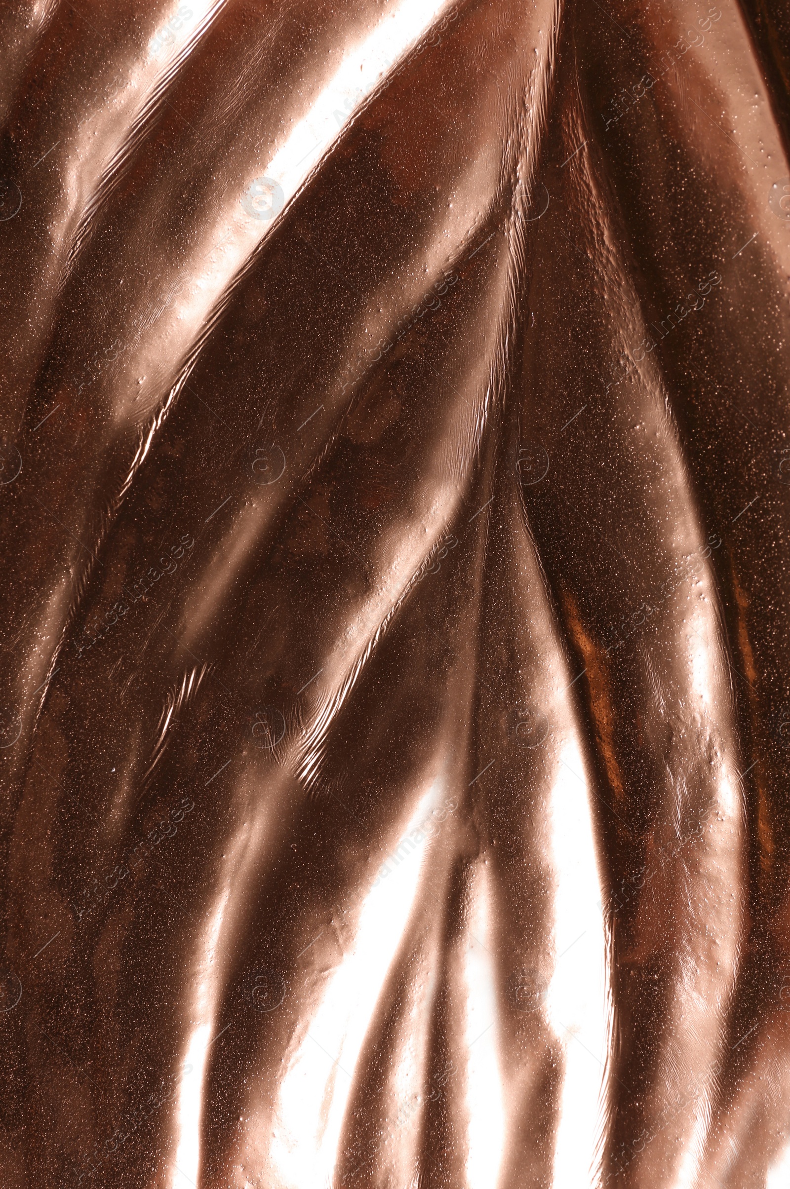 Photo of Closeup view of rose gold leaf as background