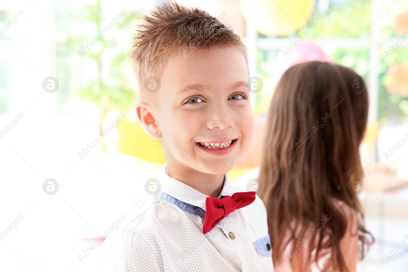 Photo of Cute little children at birthday party indoors