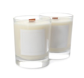 Aromatic soy candles with wooden wicks on white background