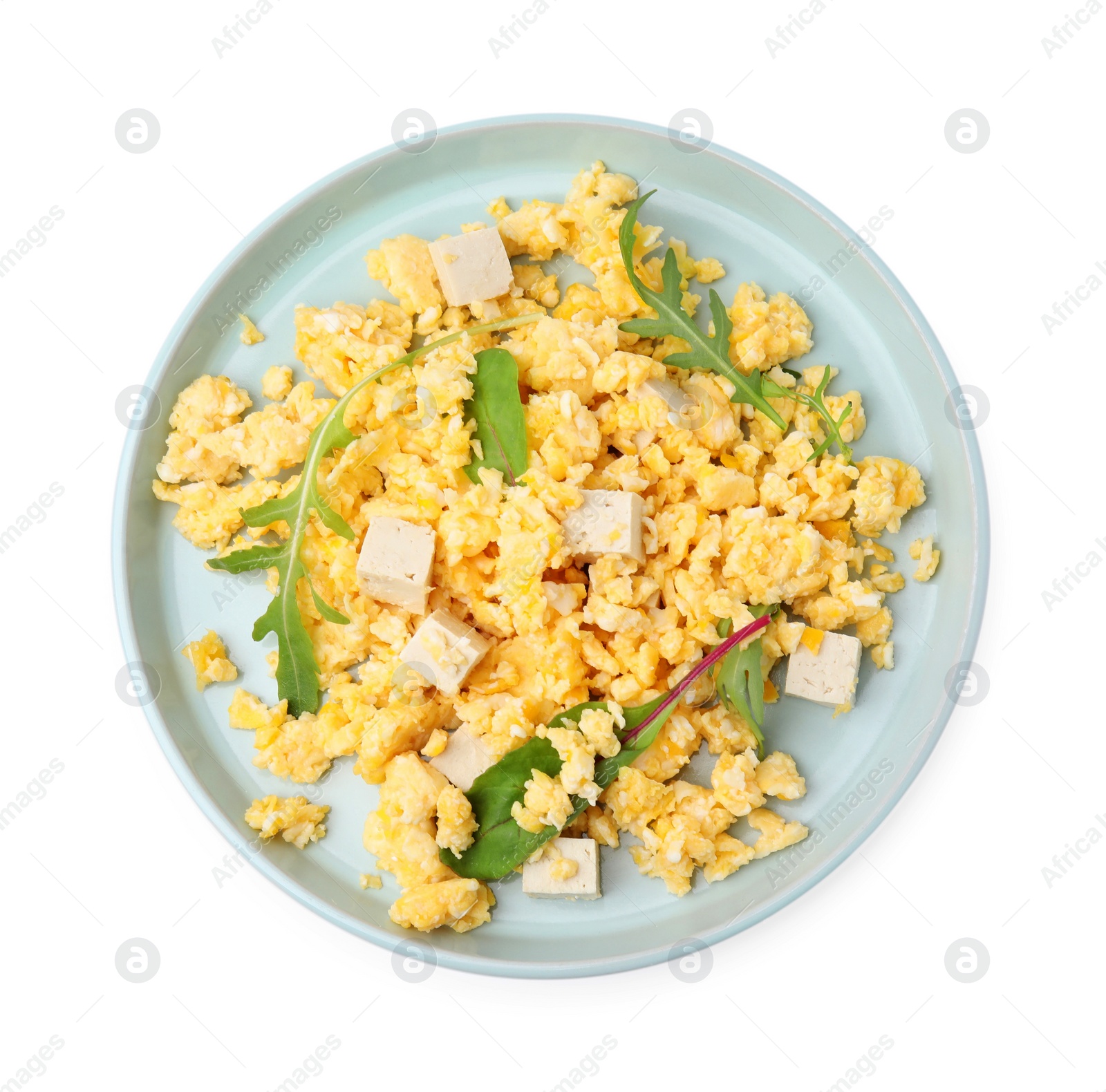 Photo of Plate with delicious scrambled eggs and tofu isolated on white, top view