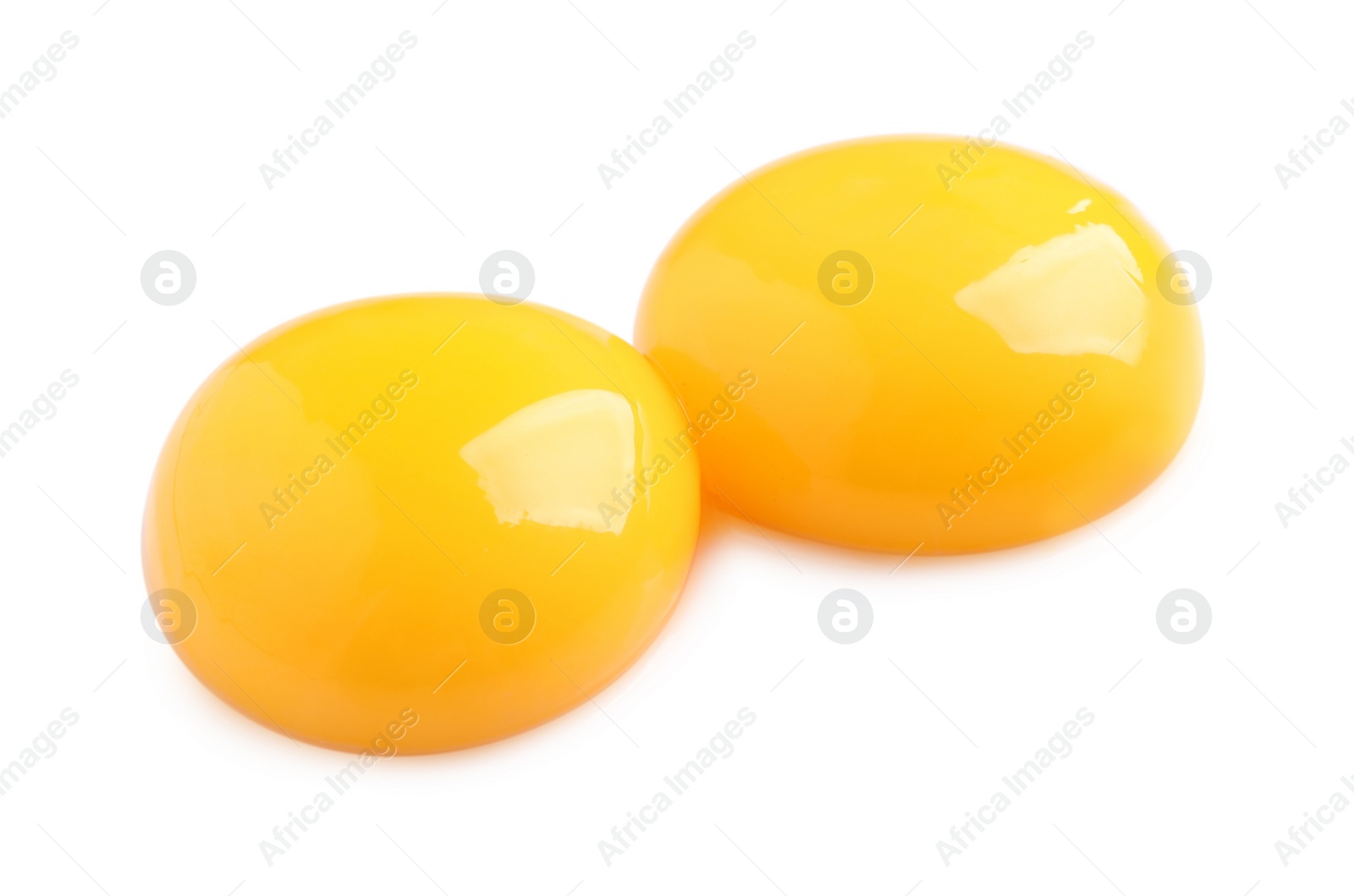 Photo of Raw chicken egg yolks on white background