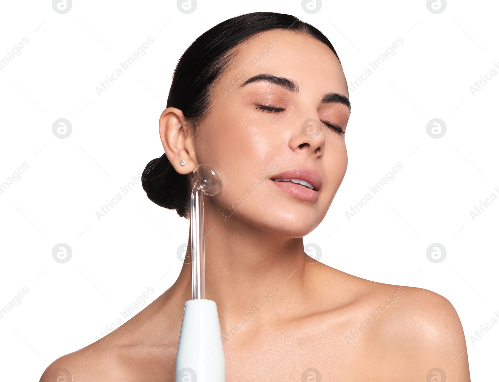 Photo of Woman using high frequency darsonval device on white background