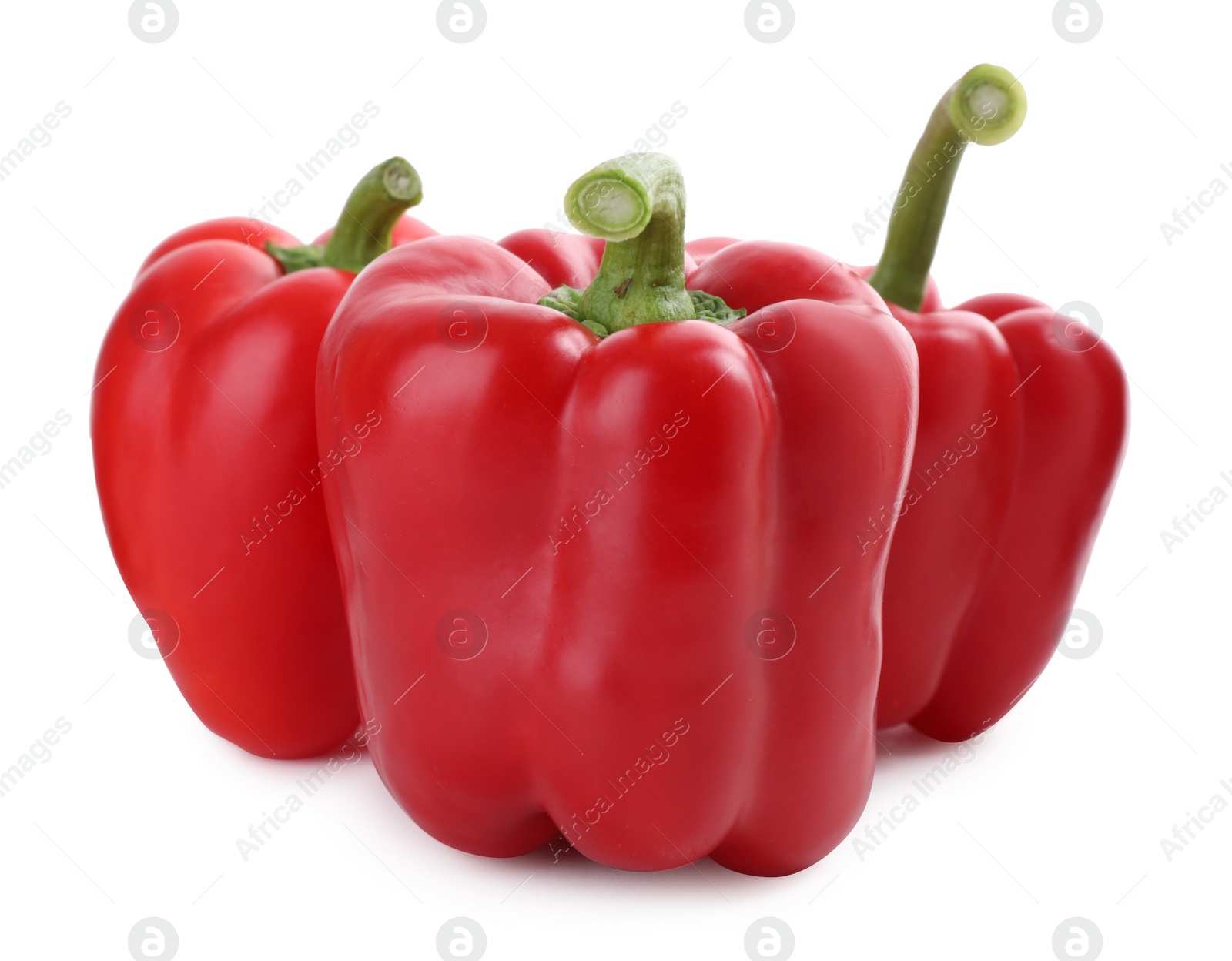 Photo of Ripe red bell peppers isolated on white