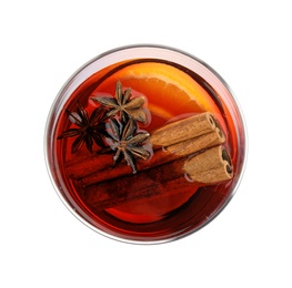 Photo of Glass of mulled wine with spices isolated on white, top view