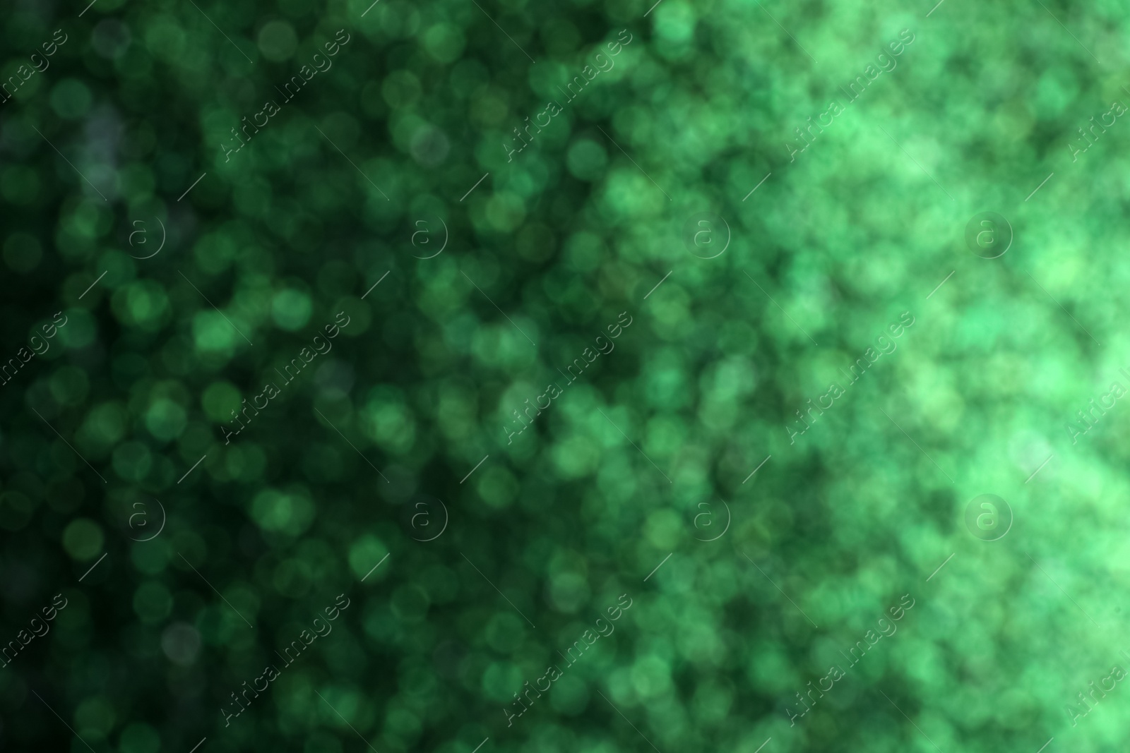Photo of Shiny green background with magical bokeh effect