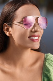 Photo of Beautiful woman in sunglasses outdoors on sunny day