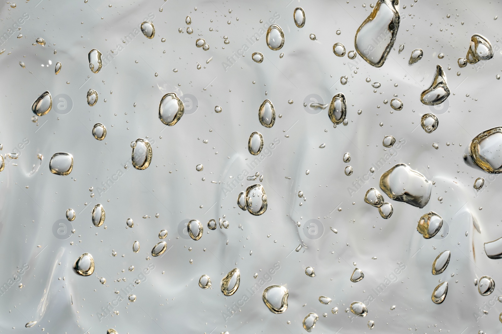 Photo of Clear facial gel as background, closeup view