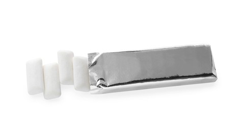 Photo of Tasty chewing gums in silver foil isolated on white