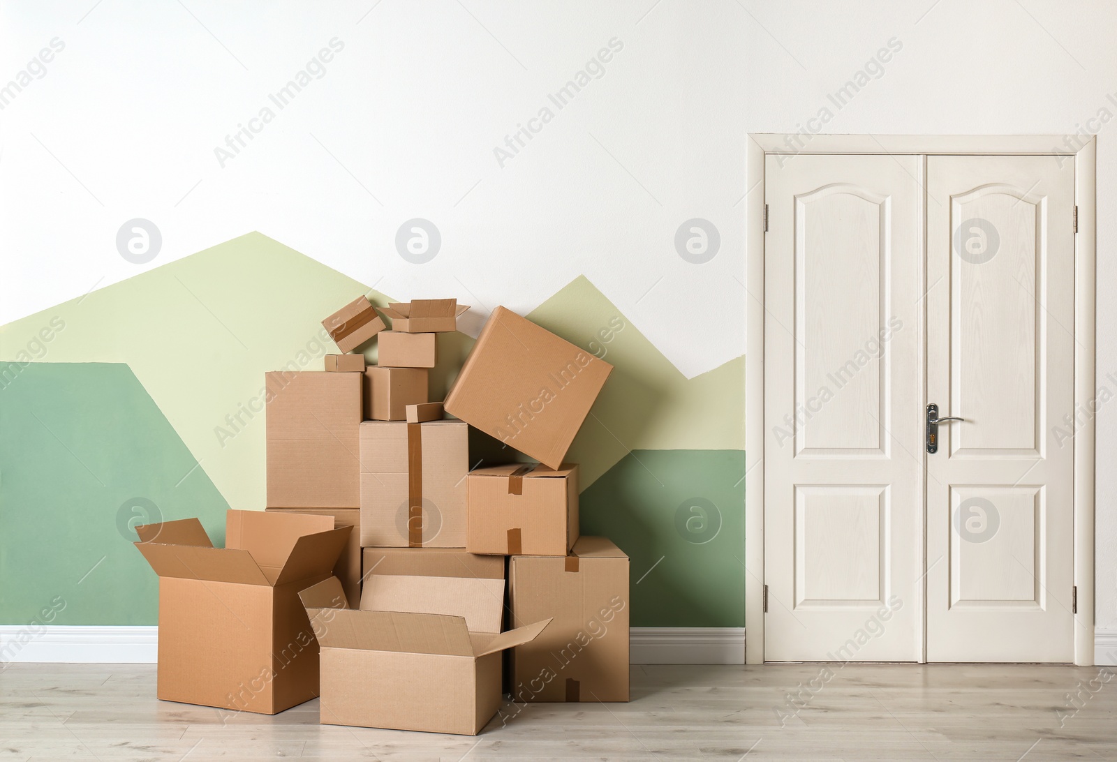 Photo of Cardboard boxes on floor indoors