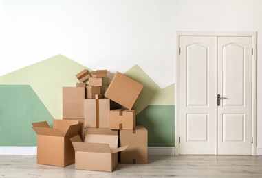 Photo of Cardboard boxes on floor indoors