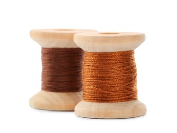 Different colorful sewing threads on white background