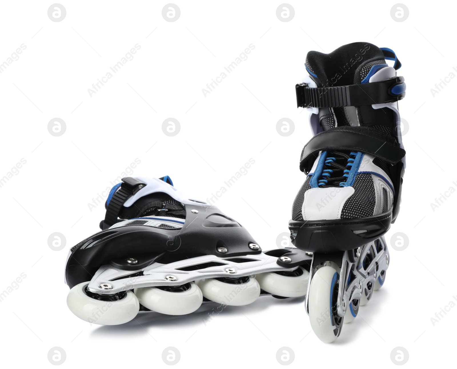 Photo of Pair of inline roller skates on white background