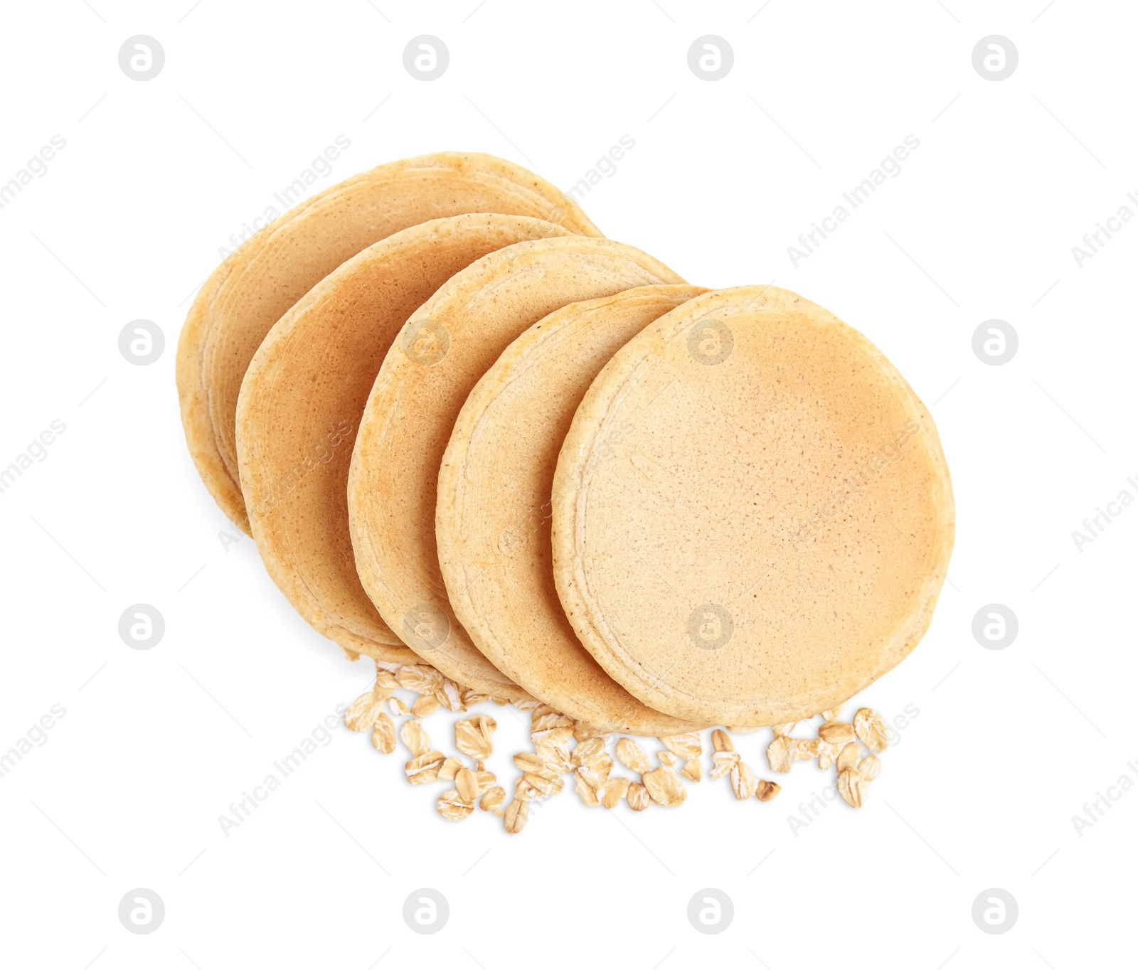 Photo of Tasty oatmeal pancakes and flakes on white background, top view
