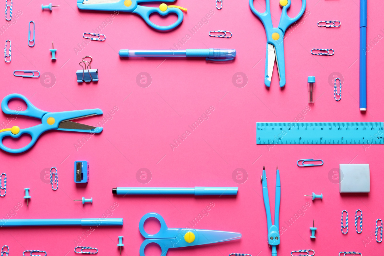 Photo of Flat lay composition with scissors and school supplies on color background. Space for text