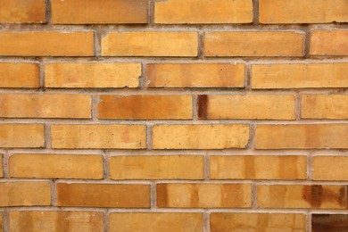Photo of Texture of beige brick wall as background
