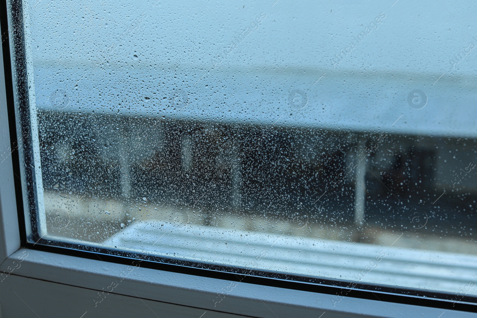 Photo of Window glass with water drops, closeup. Condensation