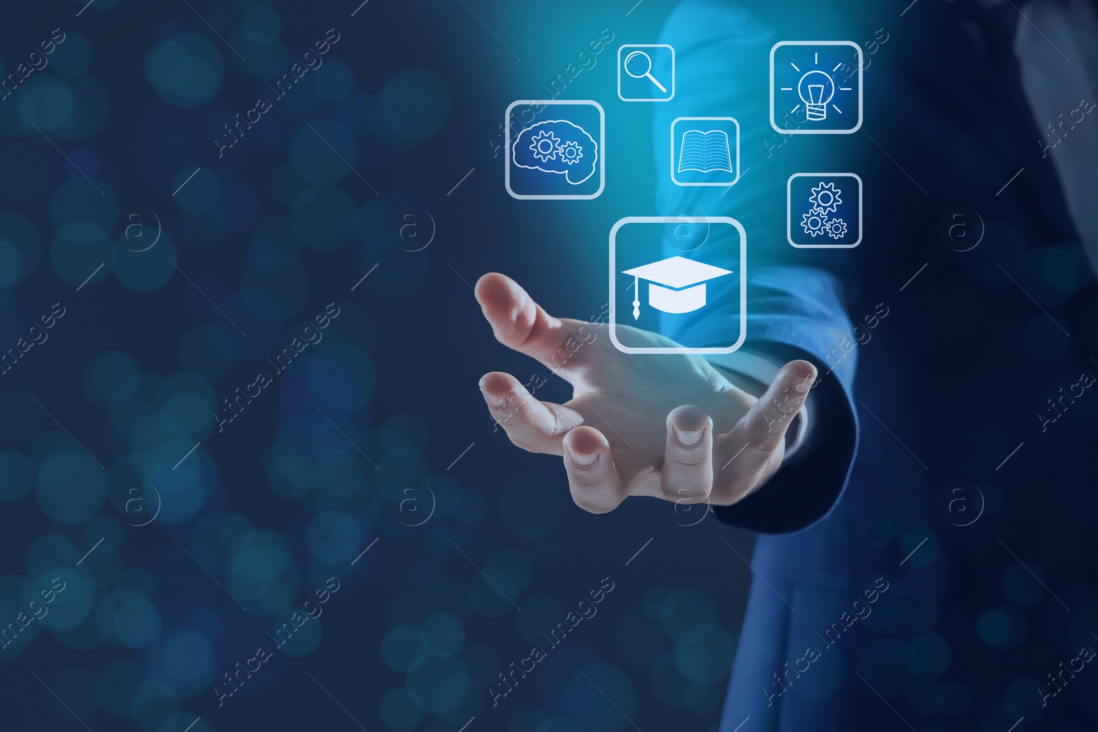 Image of E-learning. Man showing different icons on virtual screen against dark background, closeup. Space for text