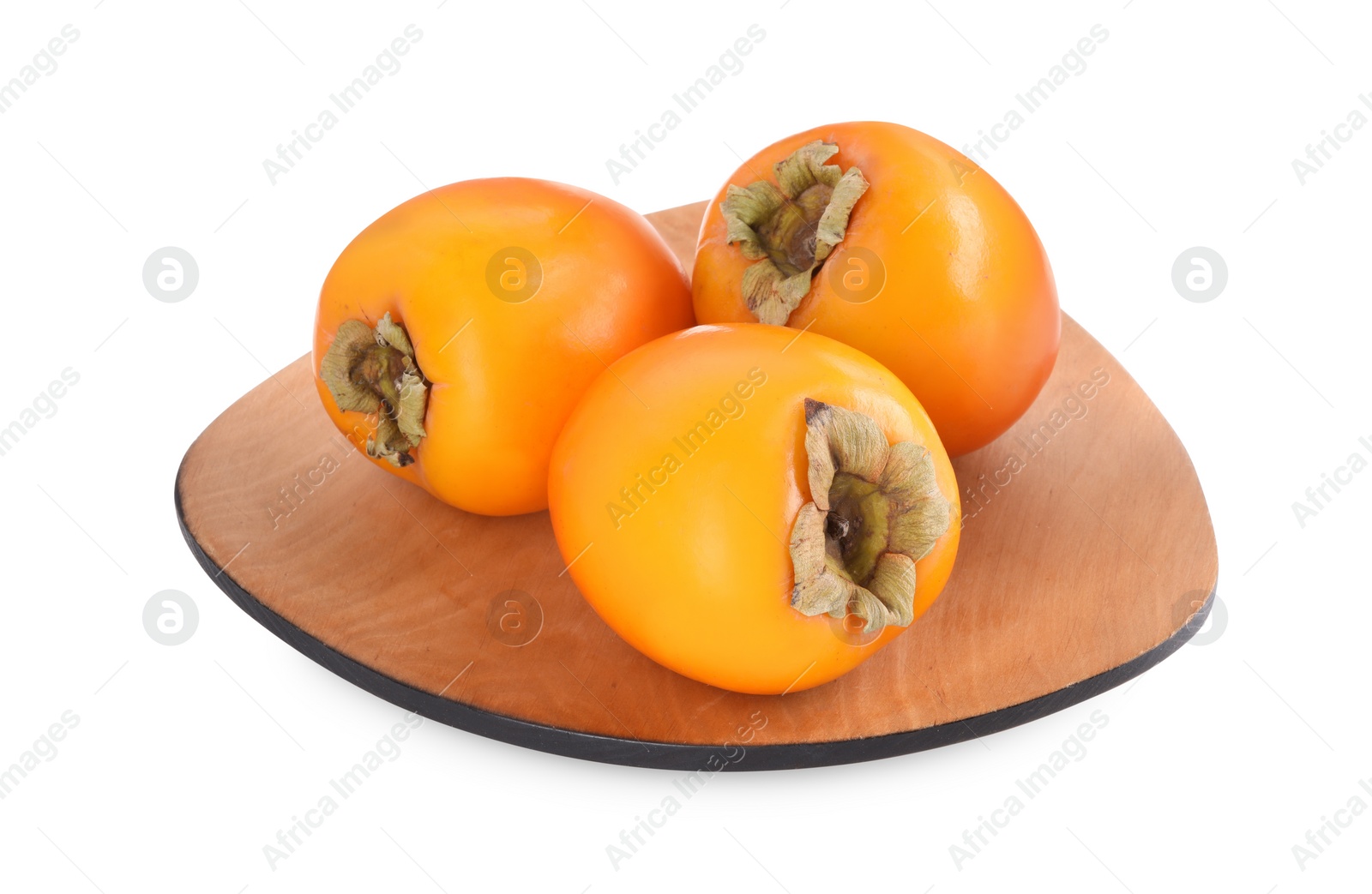 Photo of Delicious ripe juicy persimmons in wooden plate isolated on white