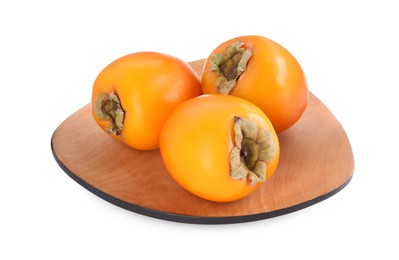 Photo of Delicious ripe juicy persimmons in wooden plate isolated on white