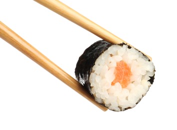 Photo of Chopsticks with tasty fresh sushi roll isolated on white