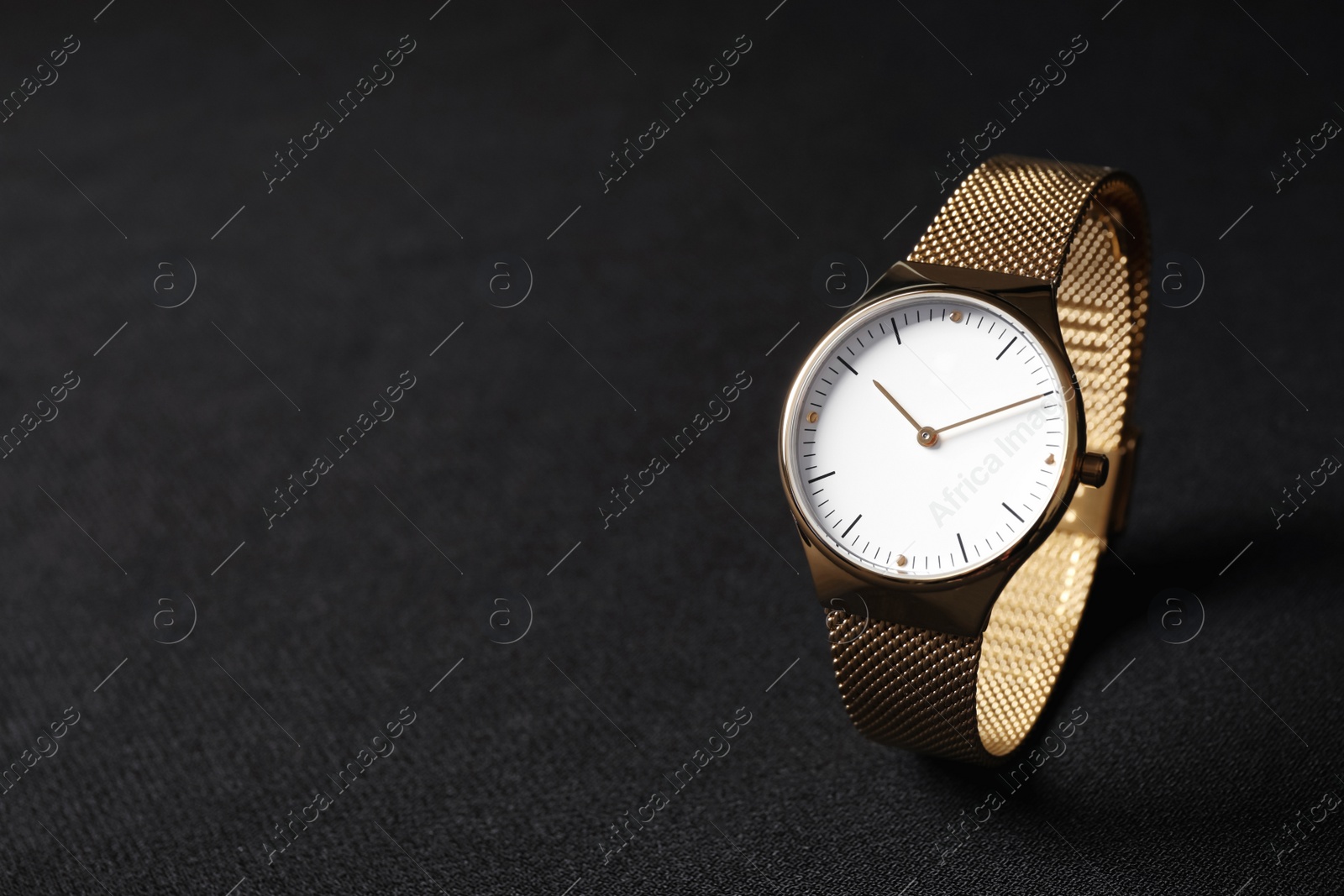 Photo of Luxury wrist watch on black background, space for text